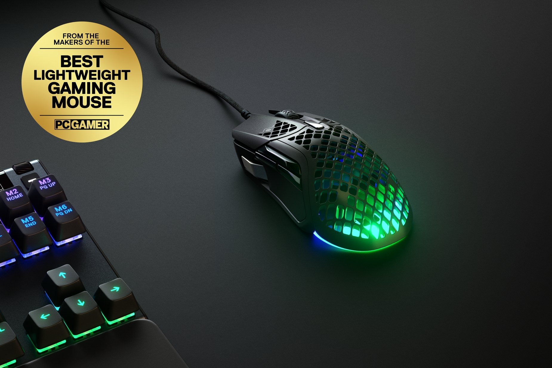 
 An Aerox 5 mouse featuring a badge with text that reads "from the makers of the best lightweight gaming mouse by PC Gamer."
 