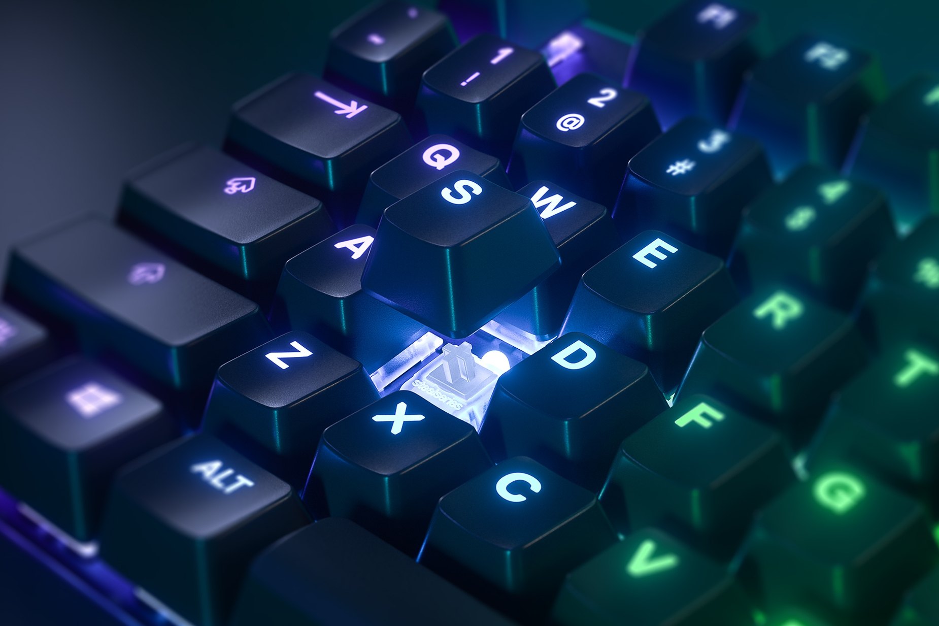 
 Zoomed in view of a single key on the German - Apex Pro gaming keyboard, the key is raised up to show the SteelSeries OmniPoint Adjustable Mechanical Switch underneath
 