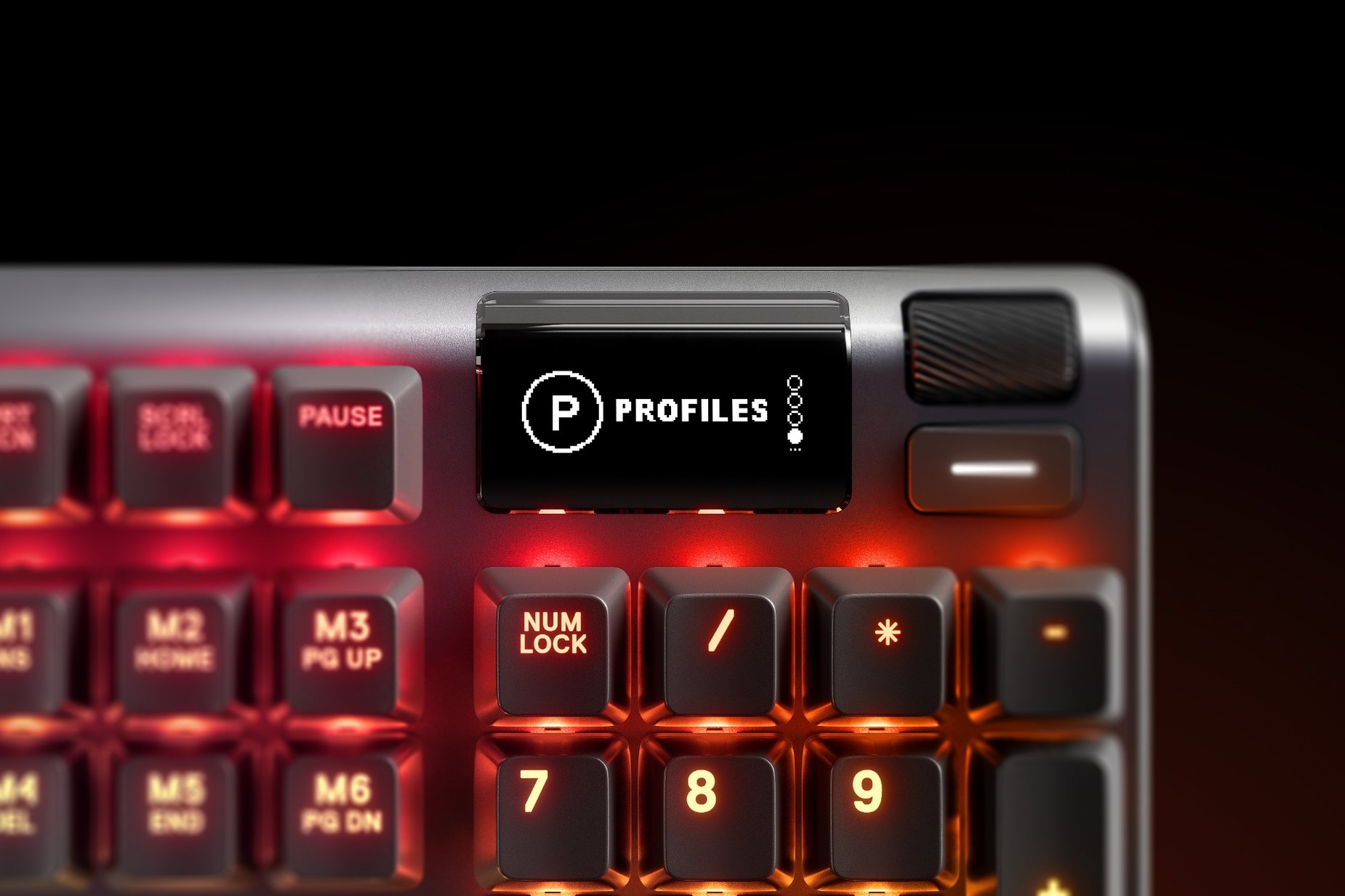 
 Zoomed in view of the multimedia and settings controls/volume roller on the Taiwanese - Apex Pro gaming keyboard
 