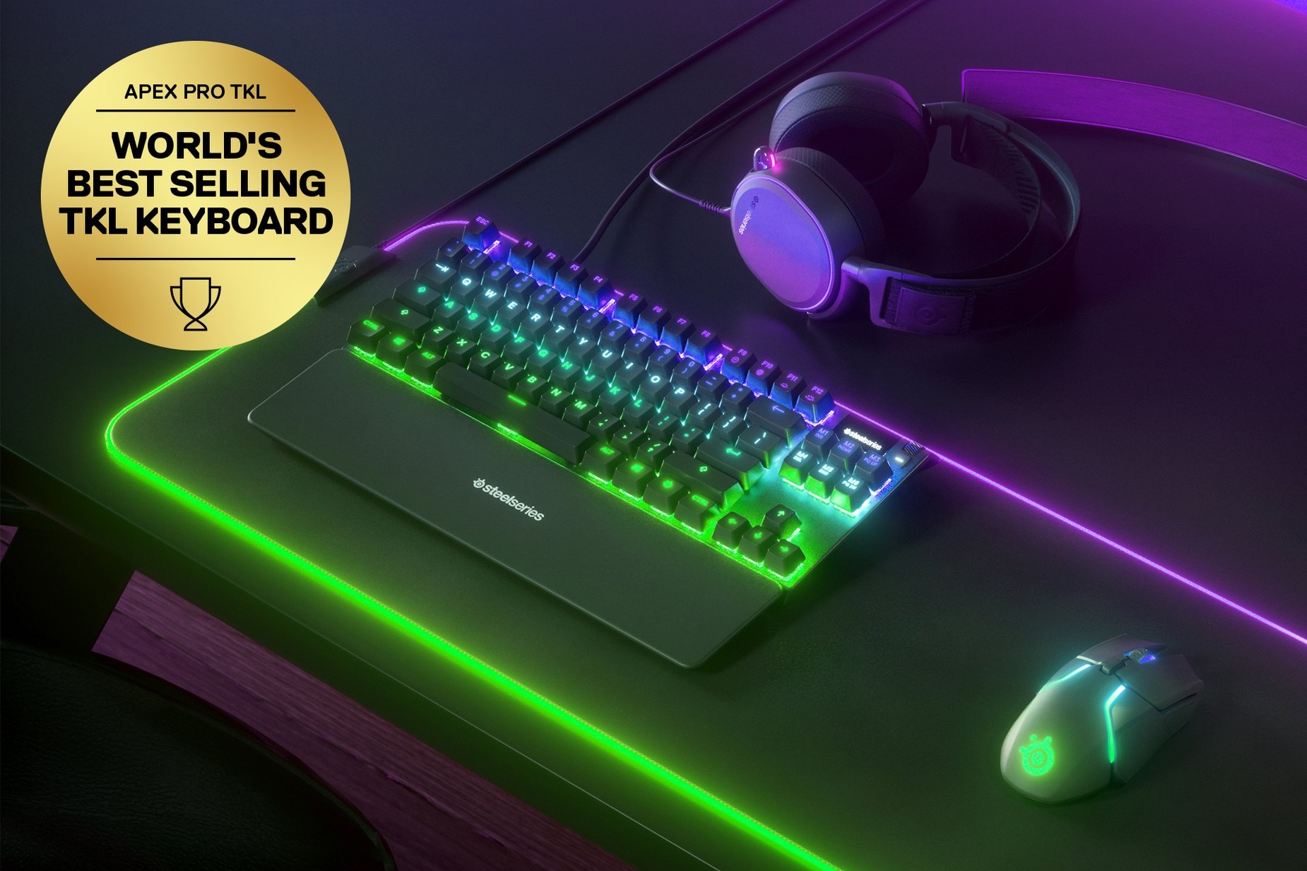 
 Nordic - Apex Pro TKL gaming keyboard on a desk with a gaming mouse, both on top of a large mousepad and a SteelSeries gaming headset next to them. Keyboard has gold award floating next to it with text "World's best selling TKL Keyboard".
 