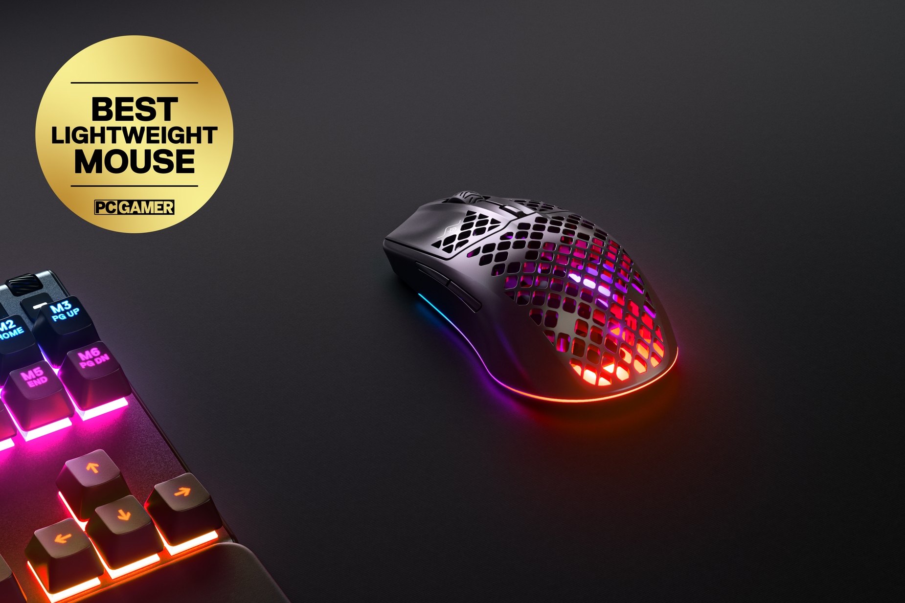 
 Aerox 3 Wireless (2022) gaming mouse, sitting next to a SteelSeries keyboard. Award sticker reads, "Best Lightweight Mouse: PC Gamer."
 
