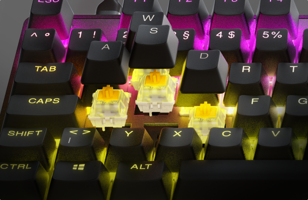 Keycaps lifted off to show the optipoint switches on an Apex 9 keyboard.