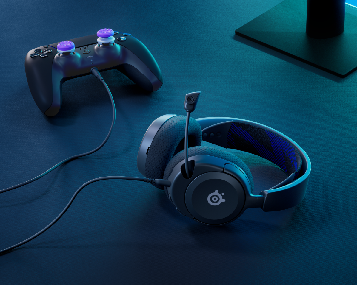 
 An Arctis Nova headset against a gaming setup.
 