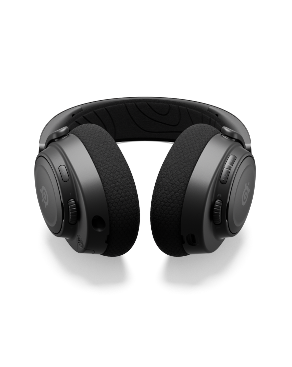 
 An Arctis Nova headset laying on a surface with the controls visible.
 