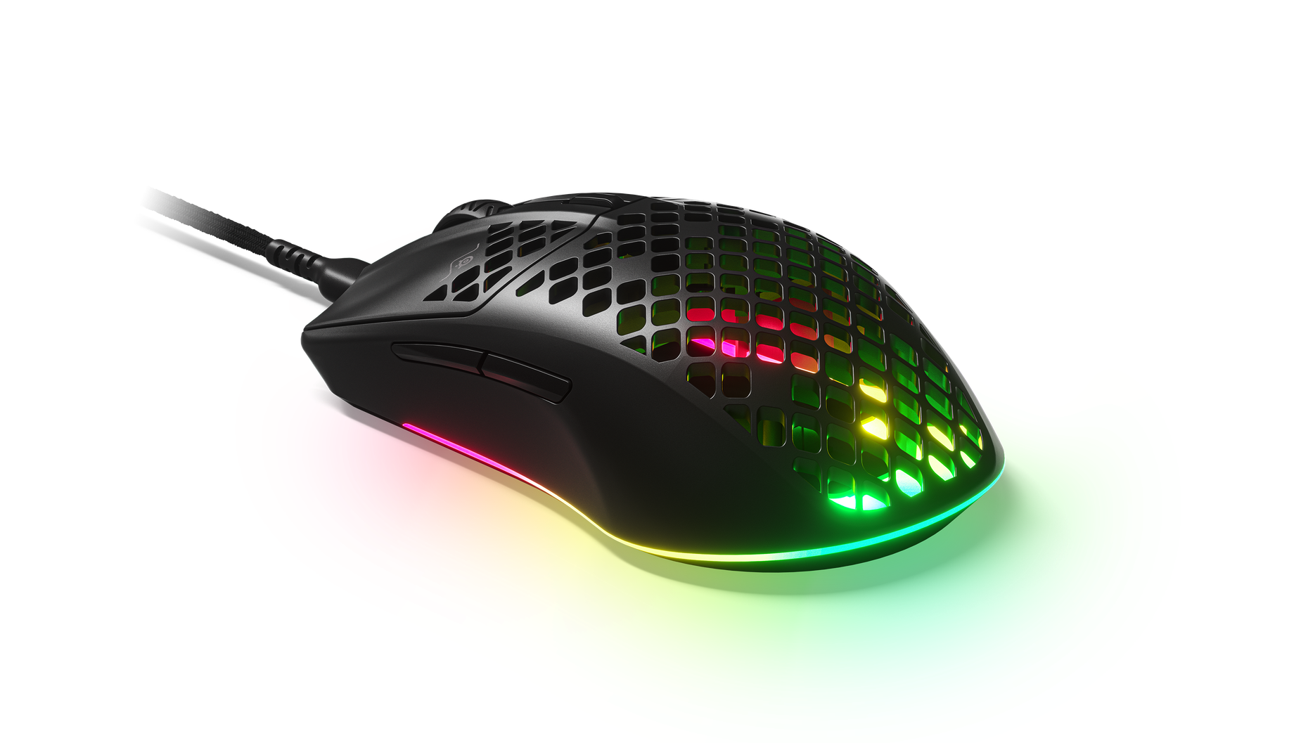 
 Angled view of Aerox 3 Wireless (2022) gaming mouse. Shows RGB gleaming through holes in mouse.
 
