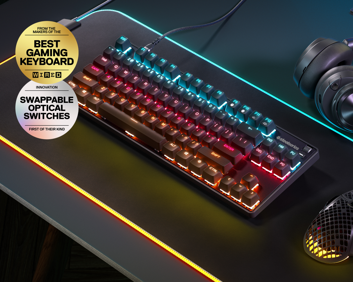 
 An Apex 9 keyboard on a desktop setup. Text reads "From the makers of the Best Gaming Keyboard, Wired Magazine" and "Innovation: Swappable Optical Switches, first of their kind."
 